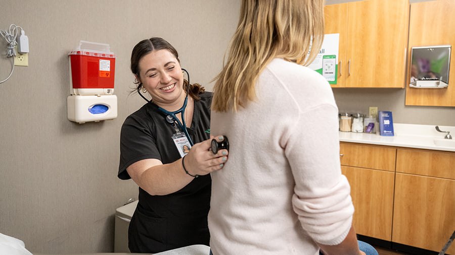 nurse smiling with stethoscope